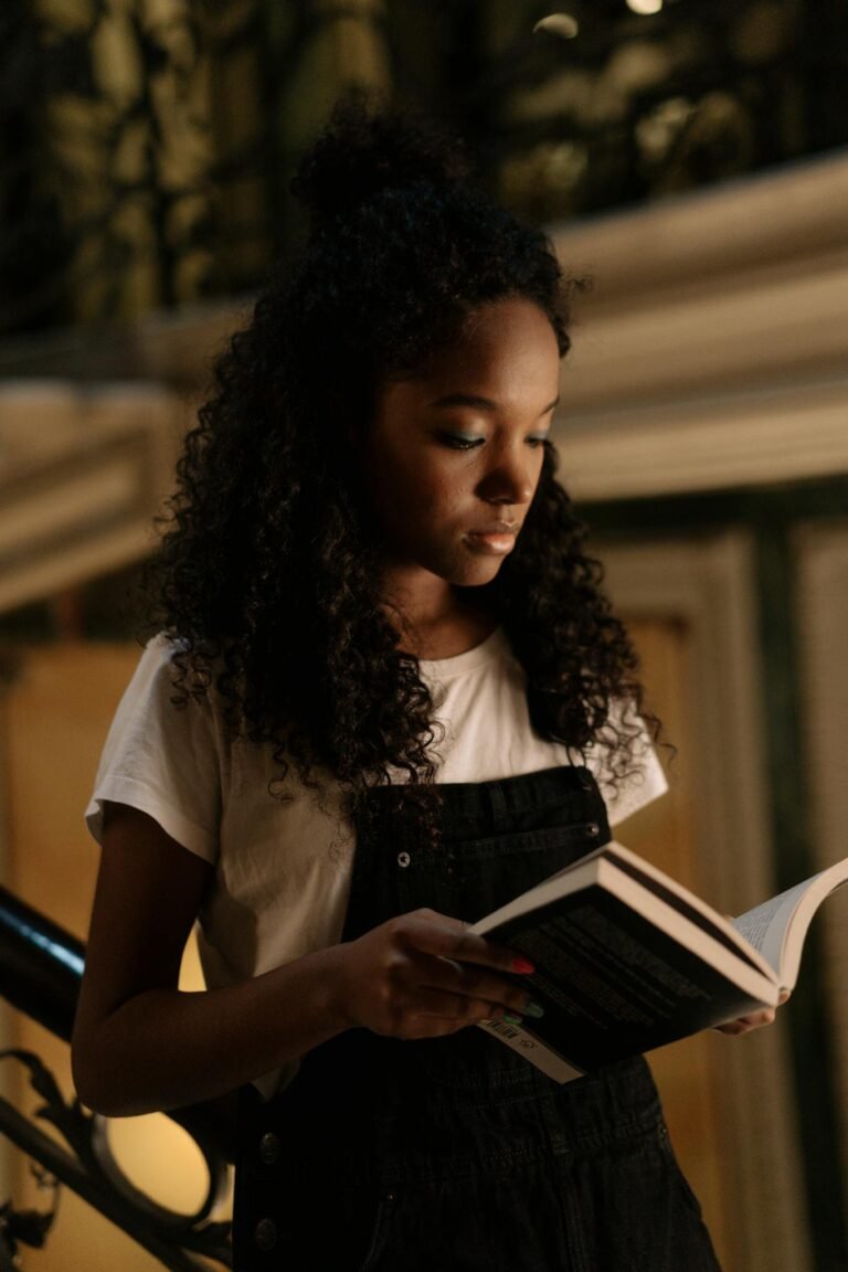Woman in Jumper Reading a Book